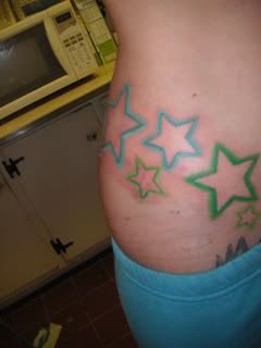Green and blue color star tat,star tattoos,girls tattoo
