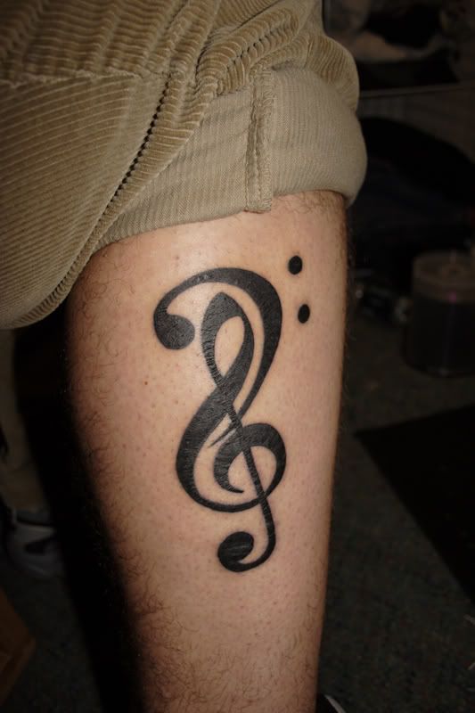 Rose tattoo design with black heart. rose tattoo designs and music notes