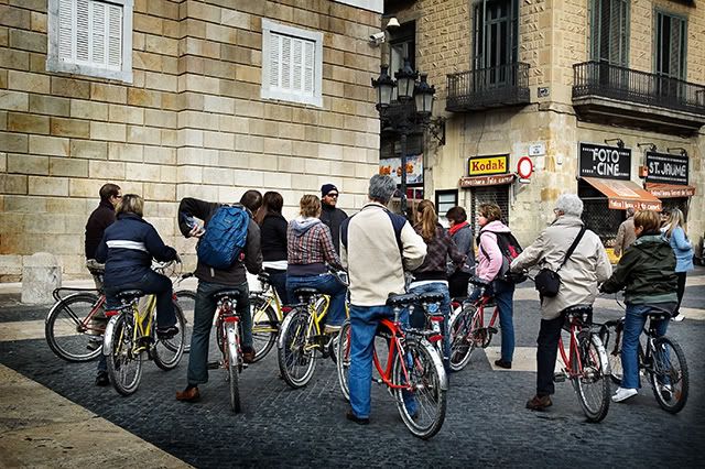 Guided bike tour in Sant Jaume square, Barcelona, Spain